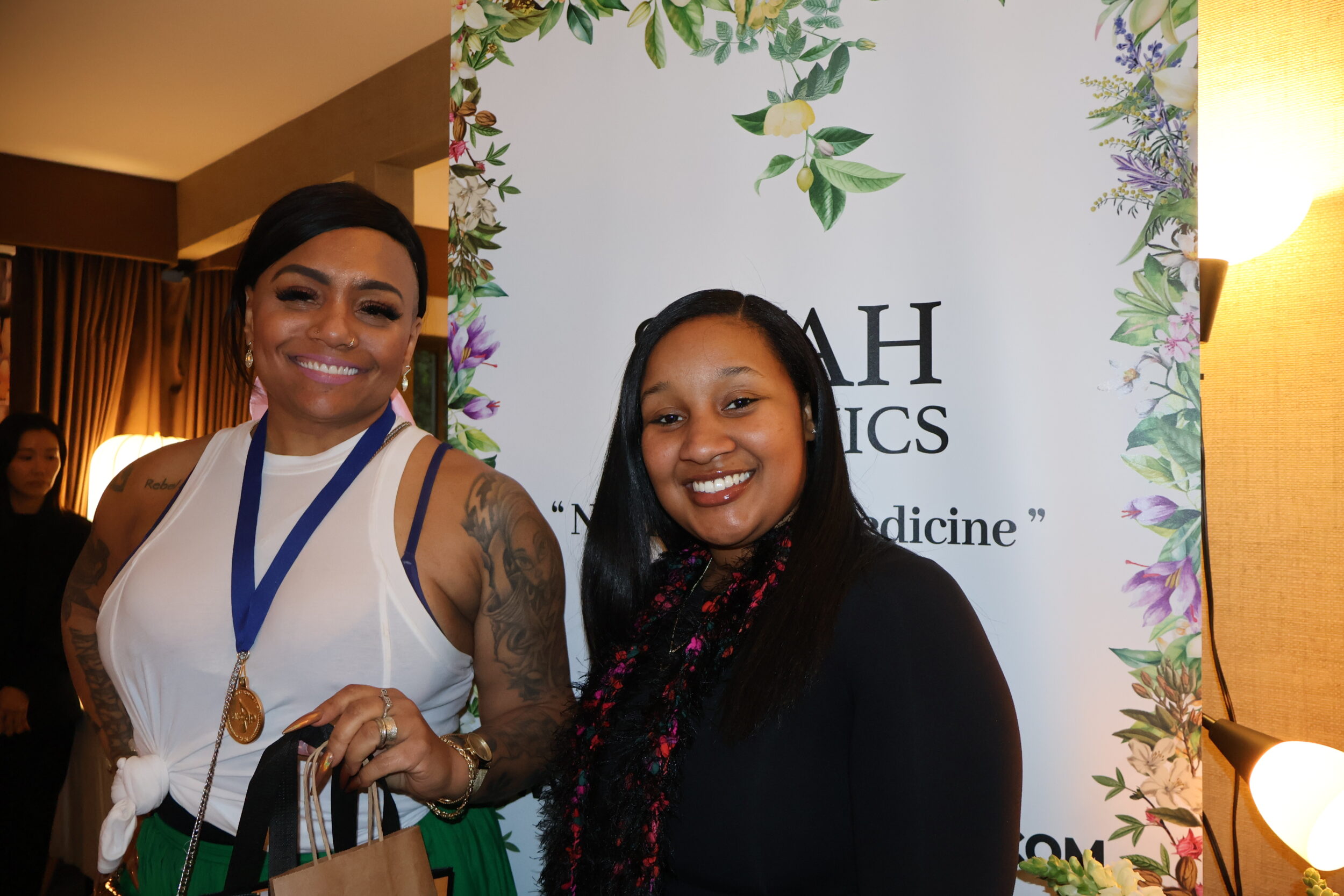Queen Sheba (l) with representative of SIYAH Organics at DPA Music Lounge during Grammy Week (Photo Courtesy of DPA).