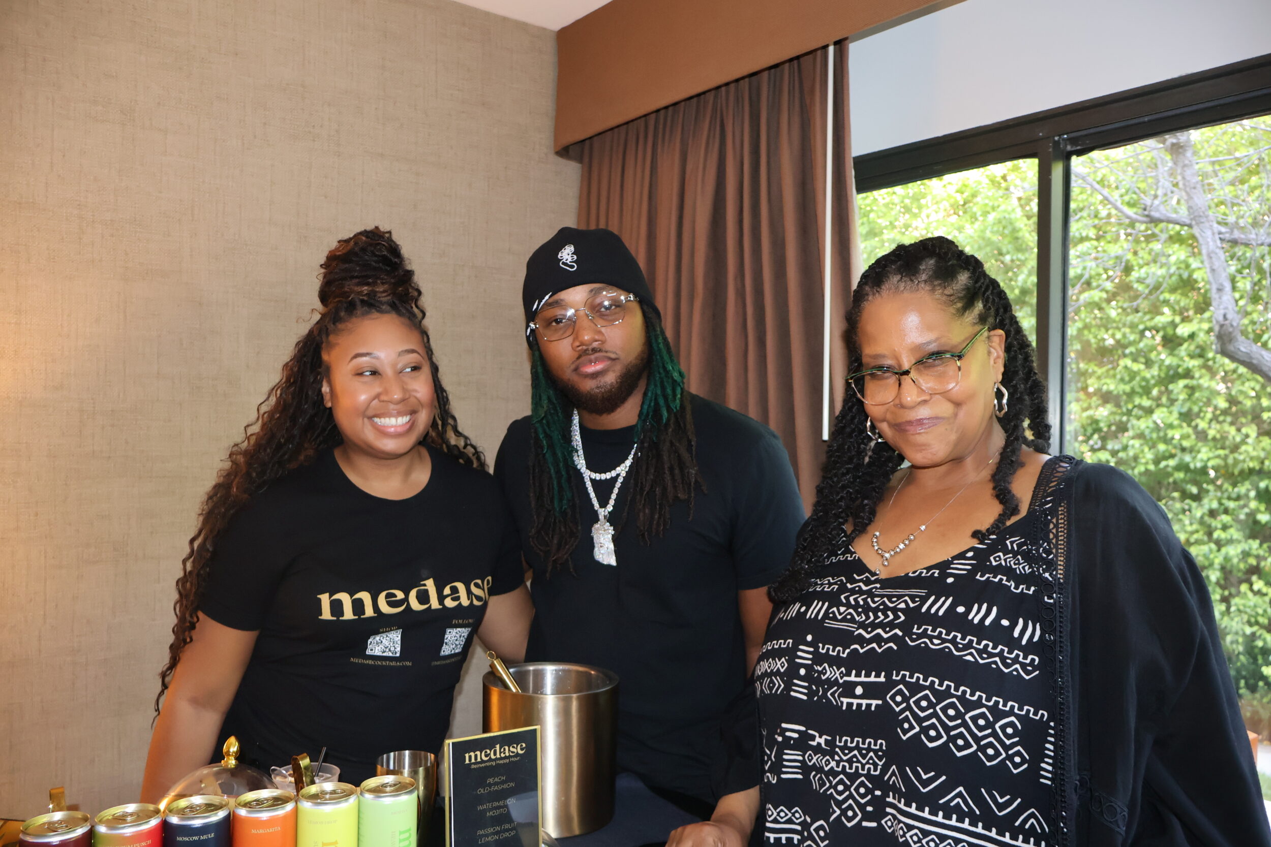 Leon Thomas III (c) with representatives of Medase Cocktails at DPA Music Lounge during Grammy Week (Photo Courtesy of DPA).