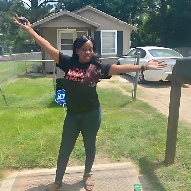 Terrica Lynn Smith in front of her first rental