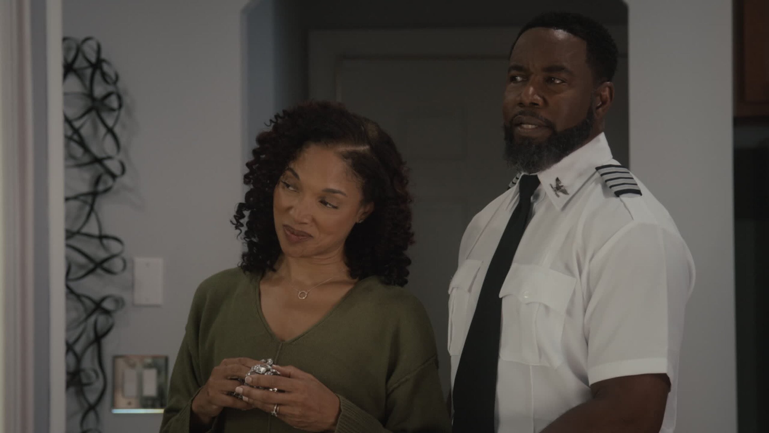 Michael Jai White and Lisa Arrindell stand together in a scene from The Secret Between Us