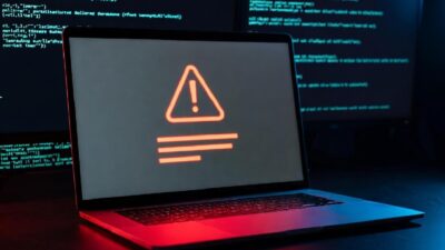 Cybersecurity breach alert on a dark, silent laptop screen -via eurAI