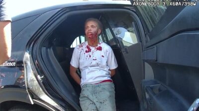 Erin Cowser after being body-slammed by cop - via bodycam footage