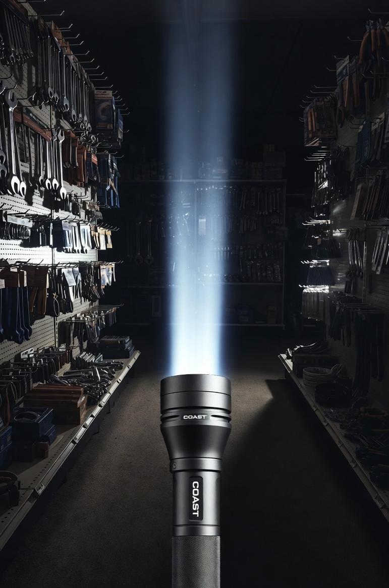 Gunmetal Coast G70 flashlight beams across dark aisle - via eurAI