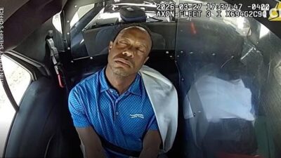 Tiger Woods appeared to drift off during the short ride to the police station in Martin County, Florida - via Martin County Sheriff's Office
