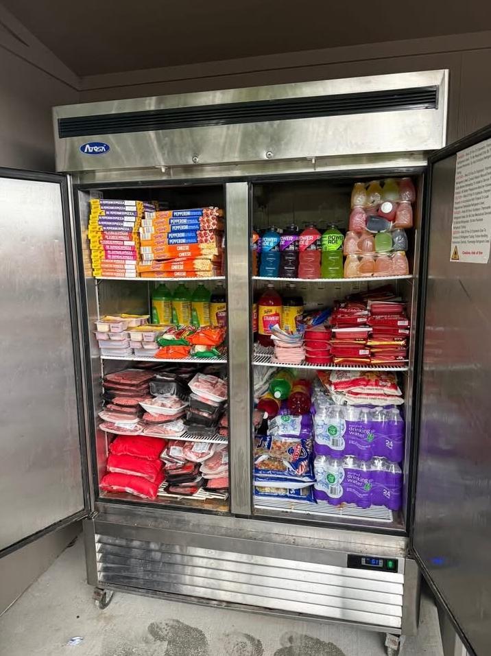 Opelousas community pantry fridge (full) - via Brashawnee Johnson