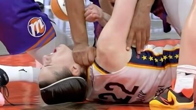 Caitlin Clark (on floor being hit in throat by Alyssa Thomas) - screenshot