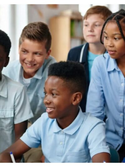 Students looking at computer screen inside a classroom via AI generated