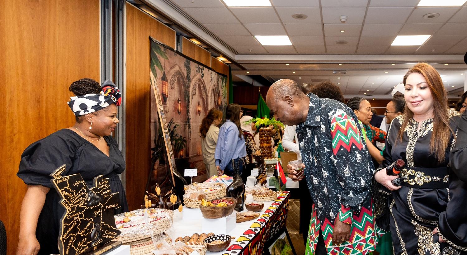 Zimbabwe ambassador to the UK, Christian M. Katsande, and Imane Dryef inspecting African countries' stalls during the Africa Day celebrations