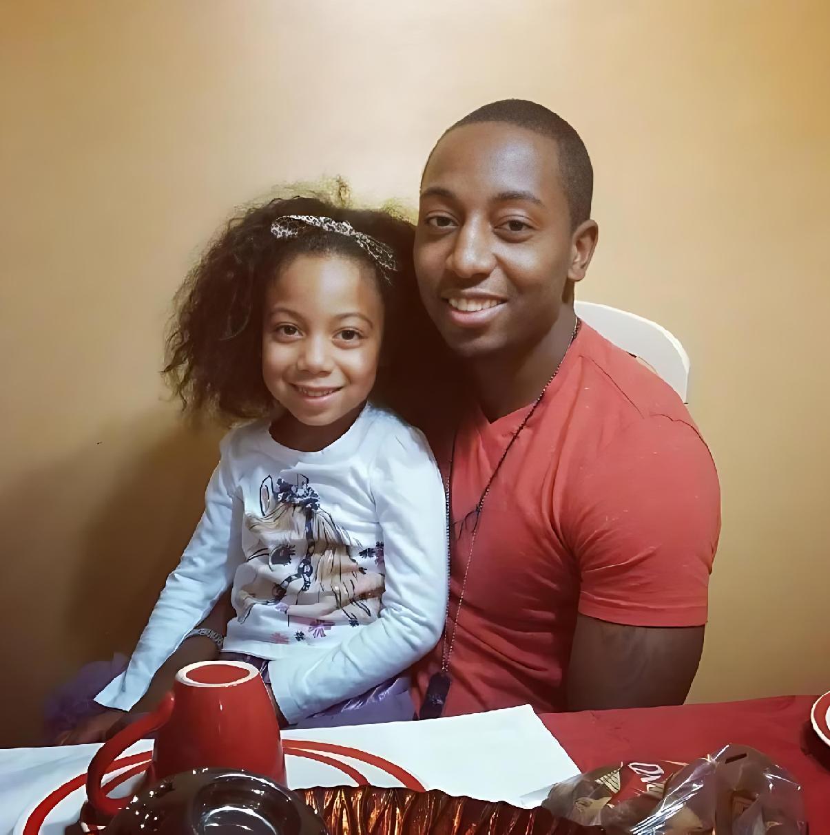 Ailea Brown, at age 5, celebrates Christmas 2014 with her father, Durrell Williams - (Photo courtesy of Durrell Williams)