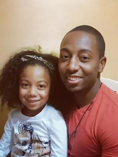 Ailea Brown, at age 5, celebrates Christmas 2014 with her father, Durrell Williams - (Photo courtesy of Durrell Williams)