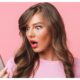 woman looking at smartphone with shocked expressions
