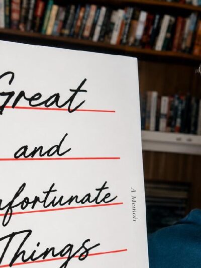 Earl Ofari Hutchinson with copy of Jason Arday's Autobiography 'Great and Unfortunate Things'