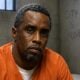 Sean Diddy Combs (in orange jail jumpsuit) - via AI