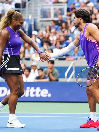 Carlos Alcaraz and Serena Williams high five during a mixed doubles quarterfinal match during Fan Week as part of the 2026 US Open at USTA Billie Jean King National Tennis Center on Tuesday, August 25, 2026 in Flushing, NY. (Photo by Darren Carroll/USTA)