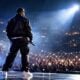 A performer (Chris Brown) takes center stage under arena lights - via eurAI