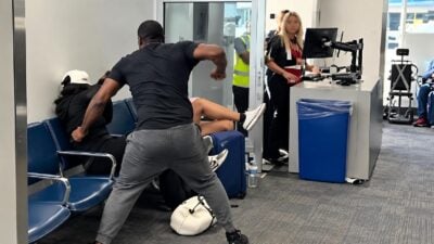 Black airport traveler punching white man during racial incident