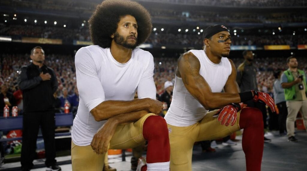 Colin Kaepernick and Eric Reed kneeling - via eurAI