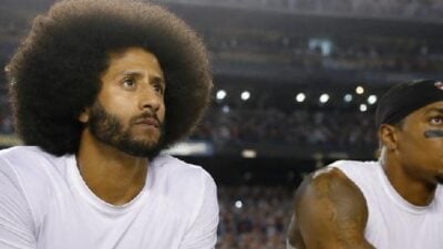 Colin Kaepernick and Eric Reed kneeling - via eurAI