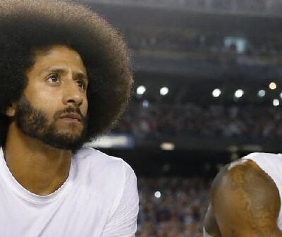Colin Kaepernick and Eric Reed kneeling - via eurAI