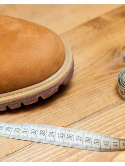 orange shoe with measuring tape