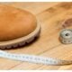 orange shoe with measuring tape