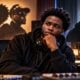 oung Black rapper-producer (Ovrkast) seated inside a modern recording studio - via eurAI.jpg