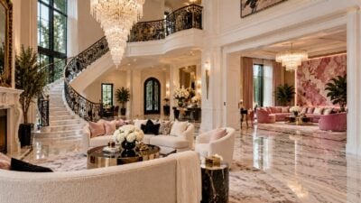 eurAI illustration of an ornate Atlanta mansion interior with marble floors, crystal chandelier and pink accents