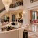 eurAI illustration of an ornate Atlanta mansion interior with marble floors, crystal chandelier and pink accents