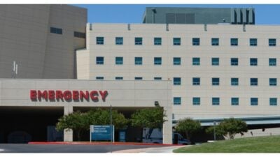 Modern hospital building in front of Emergency entrance