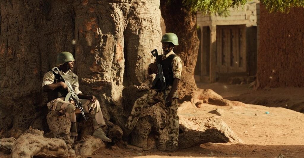 Nigerian soldiers scene in 'Clarissa' - screenshot