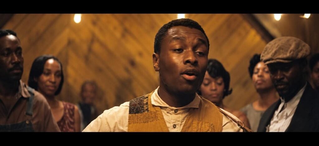 Sammie 'Preacher Boy' Moore's guitar scene from 'Sinners' - via screenshot