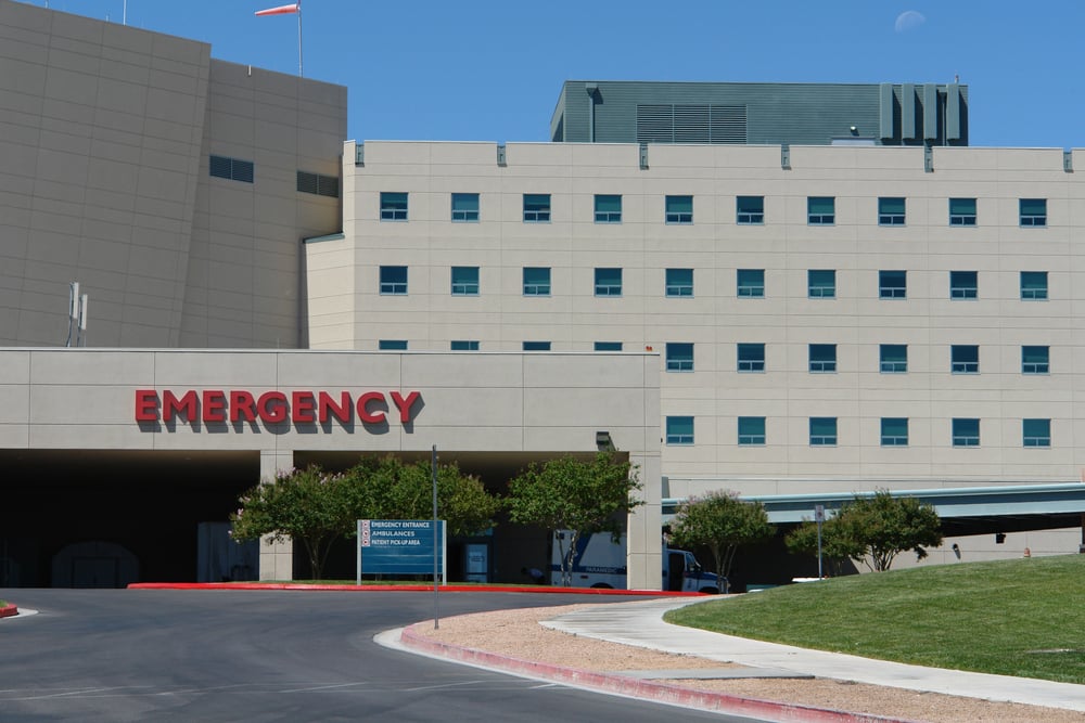 Modern hospital building in front of Emergency entrance